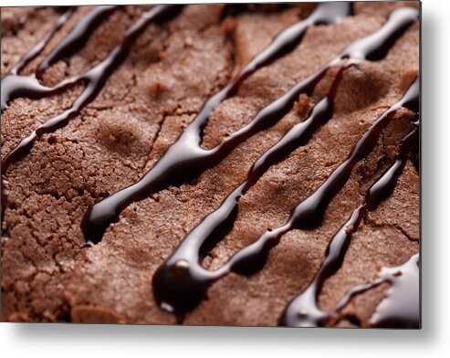 Baked Pastry Item Metal Print featuring the photograph Chocolate sauce drizzled on brownie by Jupiterimages