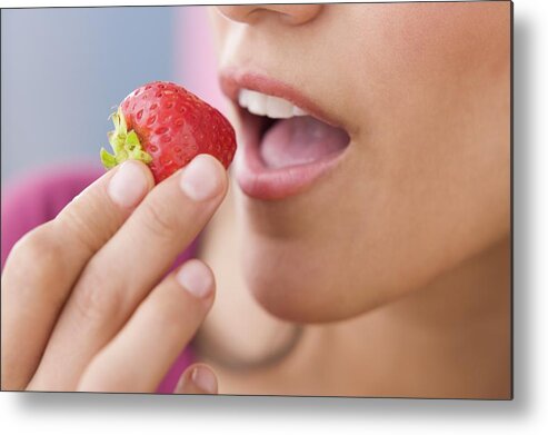 White People Metal Print featuring the photograph Close up of Hispanic woman eating strawberry by Jose Luis Pelaez Inc