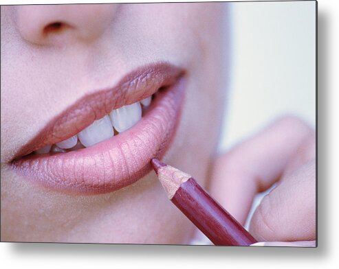 White People Metal Print featuring the photograph Close-up of woman applying lip liner by Stockbyte