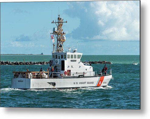 U.s Coast Guard Cutter Metal Print featuring the photograph Coast Guard Cutter Moray heads to sea. by Bradford Martin