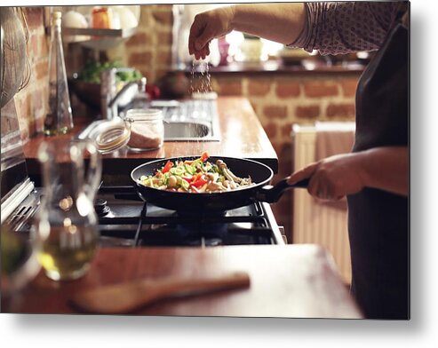 Sprinkling Metal Print featuring the photograph Cooking vegetables, step seven, seasoning by Floriana