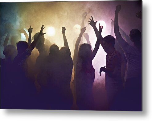 Young Men Metal Print featuring the photograph Crowd of people at concert waving arms in the air by Flashpop