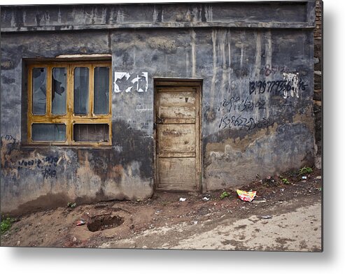 Built Structure Metal Print featuring the photograph Decaying building by rough road. by Merten Snijders
