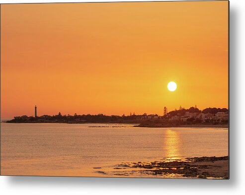 Sicily Metal Print featuring the photograph Enjoying an orange warm sunset over the sea in Sicily by Mirko Chessari