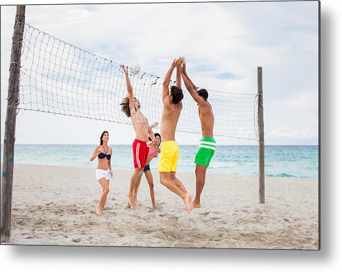 Young Men Metal Print featuring the photograph Excited friends playing volleyball by Aldomurillo