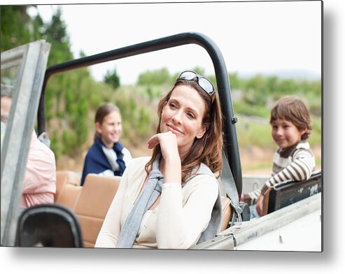 Mature Adult Metal Print featuring the photograph Family riding in vehicle by Paul Bradbury