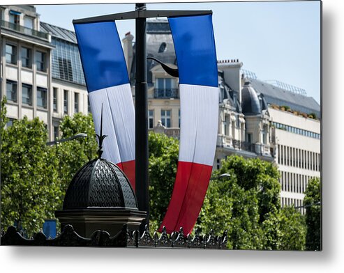Holiday Metal Print featuring the photograph French flag and typical Parisian rooftops in Champs-Elysées. by Jean-Marc PAYET