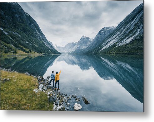 Tranquility Metal Print featuring the photograph Friends admiring the view on the banks of a norwegian fjord, Norway by © Marco Bottigelli