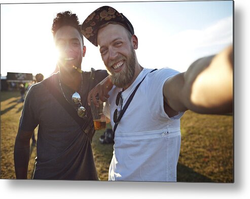 Young Men Metal Print featuring the photograph Friends making selfie at big festival concert by Klaus Vedfelt