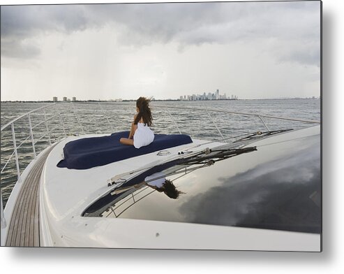 Downtown District Metal Print featuring the photograph Girl relaxing on bow of boat by Juan Silva