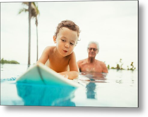 Human Arm Metal Print featuring the photograph Grandfather teaching grandson to surf by Orbon Alija