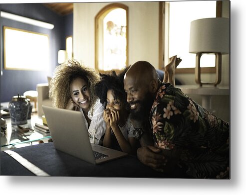 4-5 Years Metal Print featuring the photograph Happy family watching movie on a laptop by FG Trade