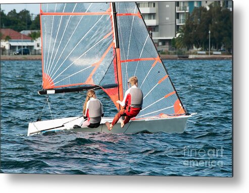 Csne55b Metal Print featuring the photograph High school students Sailing small sailboat in competition on a by Geoff Childs