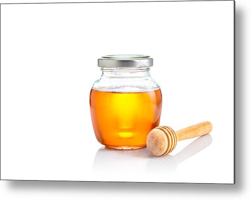 Breakfast Metal Print featuring the photograph Honey in closed lid glass jar with wooden honey dipper at its side, all on white background with copy space by Yokaew