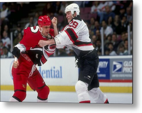 National Hockey League Metal Print featuring the photograph Hurricanes V Devils by Ezra Shaw