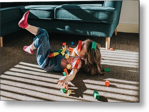 Shadow Metal Print featuring the photograph Little Girl playfully falls backwards as colourful wooden blocks scatter by Catherine Falls Commercial