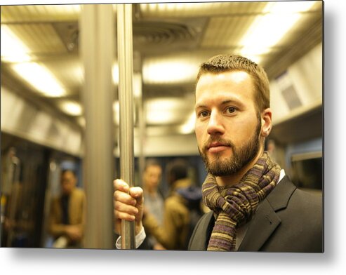 Pole Metal Print featuring the photograph Man stood on underground train by Peter Cade