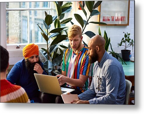 Expertise Metal Print featuring the photograph Man using laptop with multi racial colleagues by 10'000 Hours