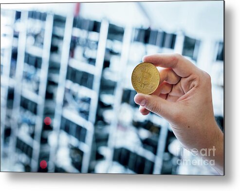 Bitcoin Metal Print featuring the photograph Man's hand showing bitcoin coin by Michal Bednarek