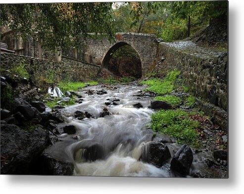 River Metal Print featuring the photograph Medieval stoned bridge water flowing in the river. by Michalakis Ppalis