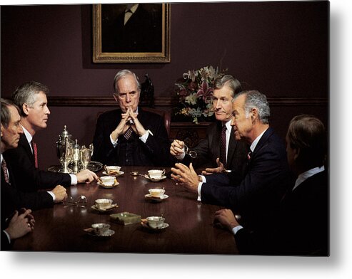Mature Adult Metal Print featuring the photograph Men in business meeting by Comstock