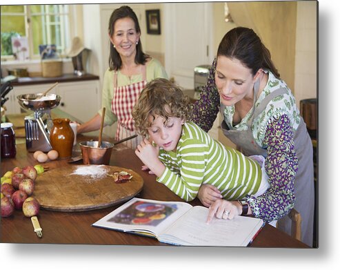 Domestic Room Metal Print featuring the photograph Multi generation family cooking food at kitchen by Eric Audras