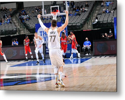 Wind Metal Print featuring the photograph New Orleans Pelicans v Dallas Mavericks by Glenn James