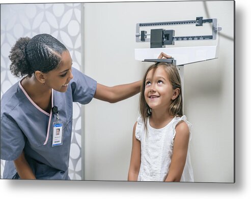 Scale Metal Print featuring the photograph Nurse measuring height of girl by FS Productions