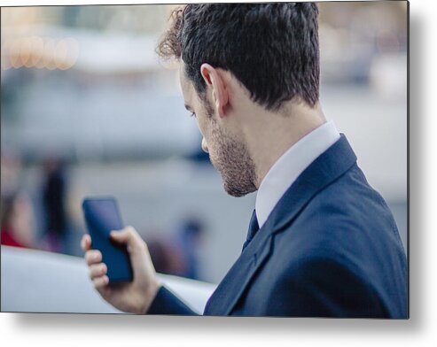 Corporate Business Metal Print featuring the photograph Over the shoulder view of businessman texting on smartphone by Kevin C Moore