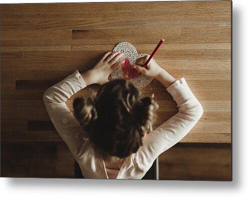 Art Metal Print featuring the photograph Overhead view of girl making valentine card on table at home by Cavan Images