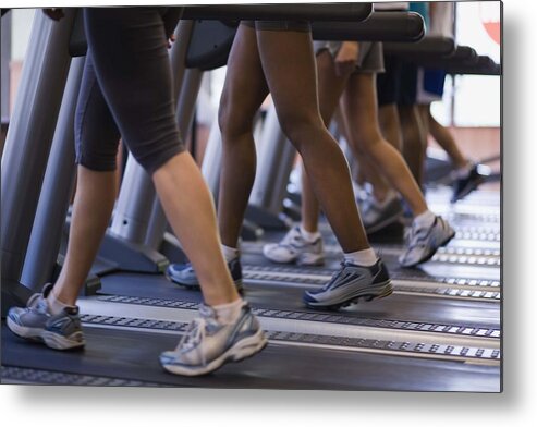 People Metal Print featuring the photograph People on treadmills in gym by Jupiterimages