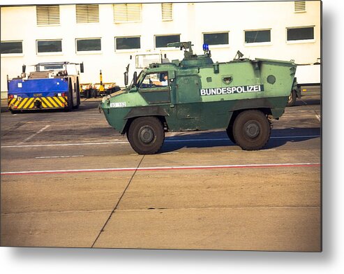 People Metal Print featuring the photograph Police armored protection vehicle in International Frankfurt Airport, by Flik47