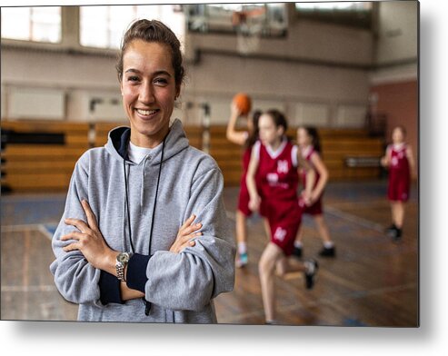 Beautiful Woman Metal Print featuring the photograph Portrait of beautiful female basketball coach by Miodrag Ignjatovic