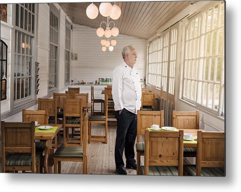 Debt Metal Print featuring the photograph Restaurant owner standing in his empty restaurant. by ClarkandCompany