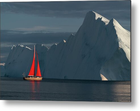 Greenland Metal Print featuring the photograph Sailboat in the low setting sun in Greenland by Anges Van der Logt