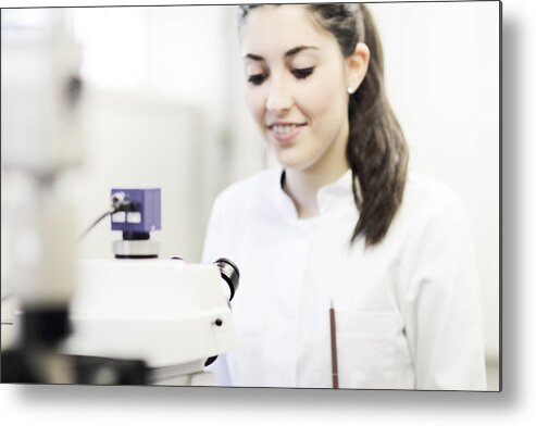 Microscope Metal Print featuring the photograph Scientist using microscope in lab by Cultura/Sigrid Gombert