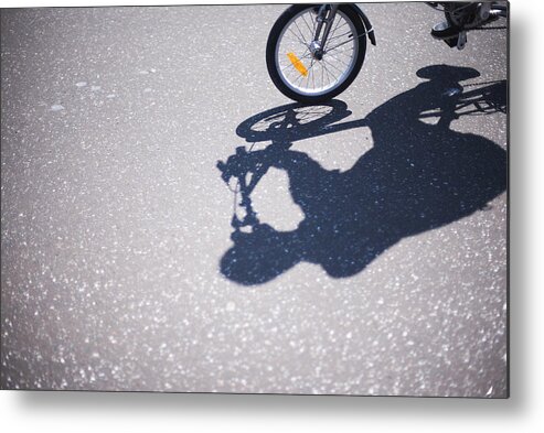 North Holland Metal Print featuring the photograph Shadow of cyclist on road by Lyn Holly Coorg