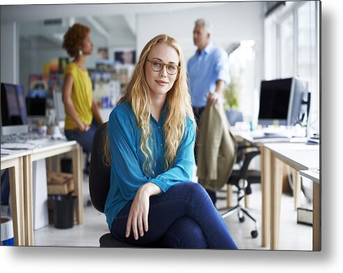 Corporate Business Metal Print featuring the photograph Smiling businesswoman sitting at creative office by Portra Images