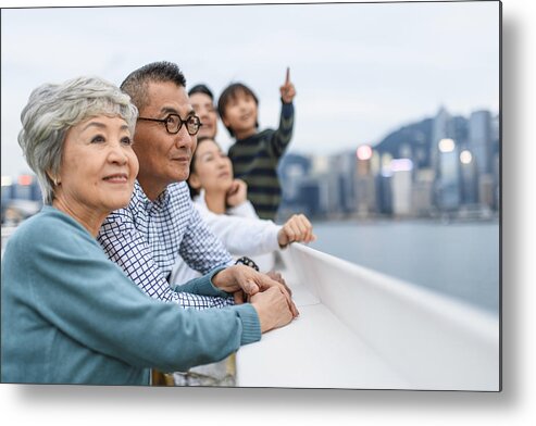 Heterosexual Couple Metal Print featuring the photograph Smiling Chinese Senior Couple Enjoying Hong Kong Views by AzmanL