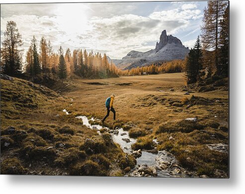 Scenics Metal Print featuring the photograph Solo Hiker Walking On A High Mountain Plain by Massimo Colombo