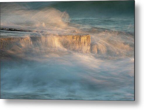 Stormy Sea Metal Print featuring the photograph Stormy windy sea waves splashing on a rocky seashore at sunset by Michalakis Ppalis