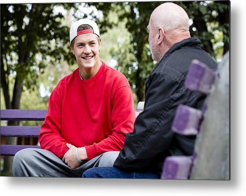 Young Men Metal Print featuring the photograph Student and teacher talking on park benches by Hill Street Studios