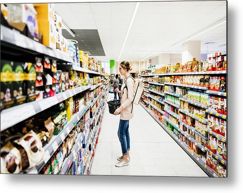 Part Of A Series Metal Print featuring the photograph Supermarket Aisle With People Grocery Shopping by Tom Werner