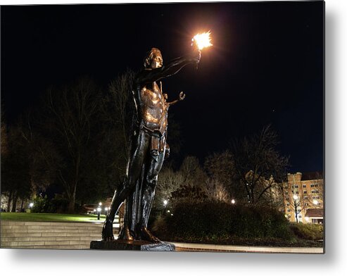 University Of Tennessee At Night Metal Print featuring the photograph Torchbearer statue at the University of Tennessee at night by Eldon McGraw
