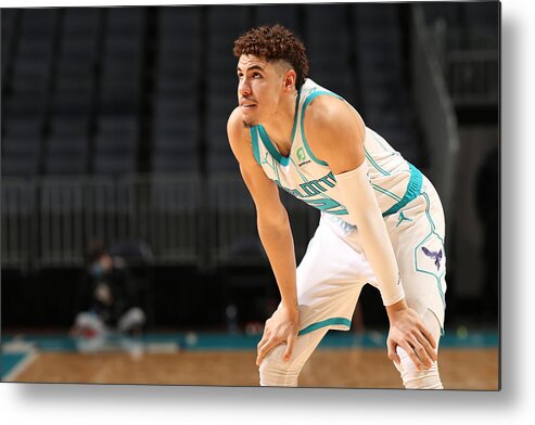 Lamelo Ball Metal Print featuring the photograph Toronto Raptors v Charlotte Hornets by Kent Smith