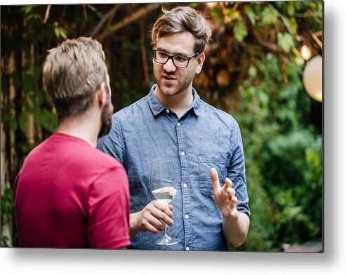 Young Men Metal Print featuring the photograph Two Friends Chatting And Drinking At BBQ by Hinterhaus Productions
