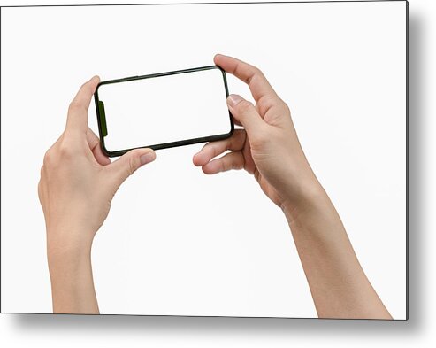 Empty Metal Print featuring the photograph Two hands holding big screen smart phone by Issarawat Tattong