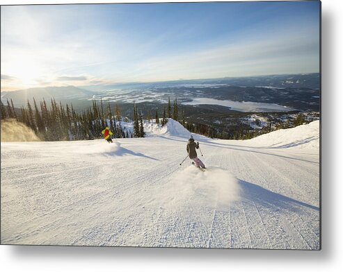 Mid Adult Metal Print featuring the photograph Two people on ski slope at sunlight by Noah Clayton