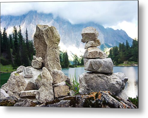 Two Metal Print featuring the photograph Two stone towers as route markers. by Bernhard Schaffer