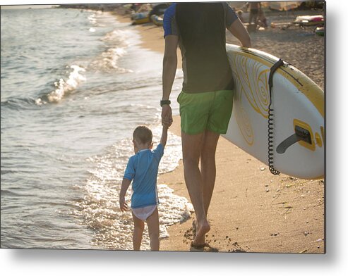 Child Metal Print featuring the photograph Two surfers on the beach by Freemixer